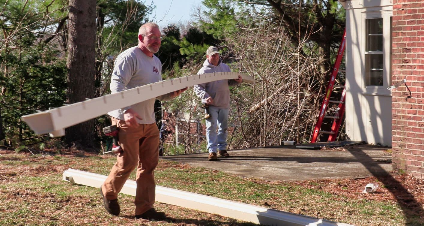 A&A team loading custom-cut gutter sections