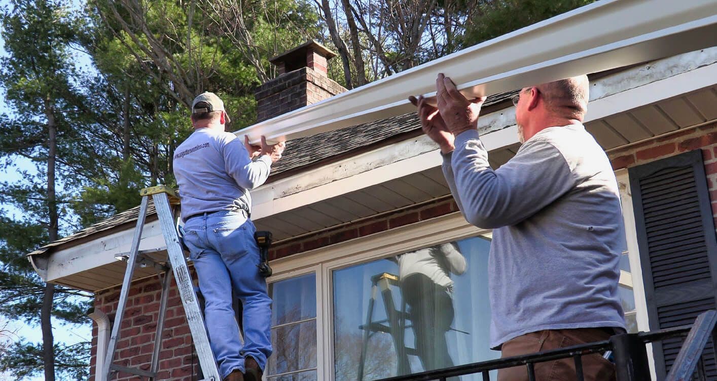 A&A Seamless Gutters crew installing seamless gutters on a Connecticut home